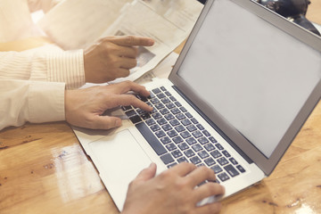 man's hand working with laptop computer notebook, selective focu