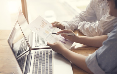 people working together with laptop computer