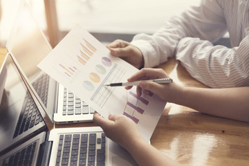people working together with laptop computer