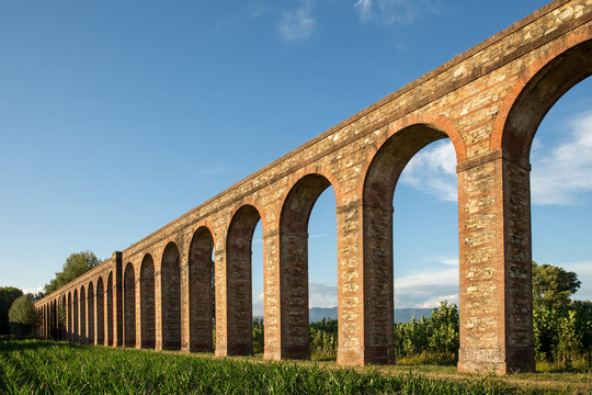 Ancient Italian Aqueduct in Evening Light