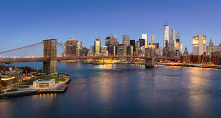 Fototapeta na wymiar Aerial view of the Brooklyn Bridge at sunrise and Manhattan Lower East Side Financial District. New York City