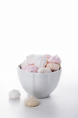 Homemade meringues on white plate.