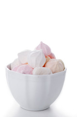 Homemade meringues on white plate.