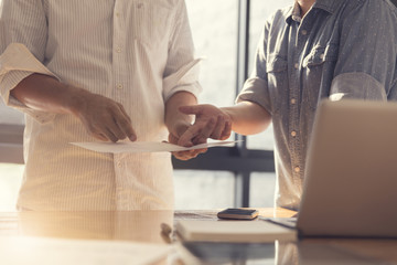 people working with document together