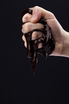 Hand Squeezing Chocolate