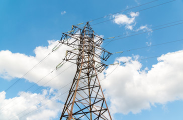 High-voltage power line on sky background