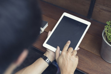 man's hand using digital tablet