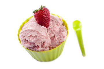 a green bowl with strawberry ice cream