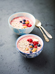 Berry smoothie bowl with buckwheat flakes and almonds