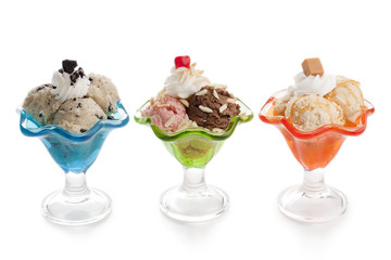 three glass of flavored ice cream