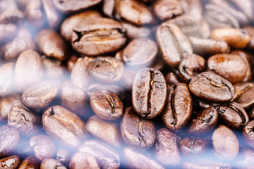 Roasted coffee beans with the smoke