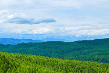 Fototapeta na wymiar valley in the distance against the backdrop of peaks