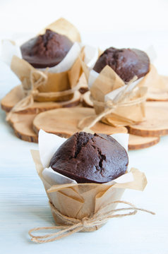 Chocolate muffins on wooden stand
