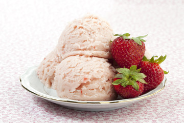 white plate with strawberry ice cream and strawberries