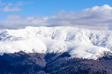 Fototapeta na wymiar Winter landscape over Carpathian Mountains. Panorama of snow mou
