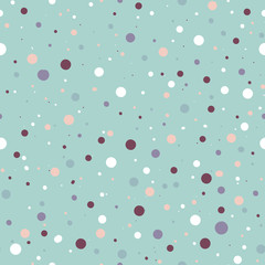 Cute seamless pattern or texture with colorful polka dots on white background. 