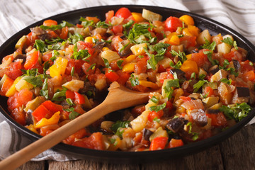 Spanish cuisine: vegetable stew Pisto manchego macro on a plate. Horizontal

