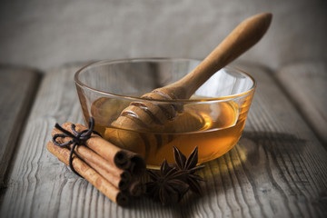 honey in a transparent bowl with spices