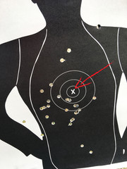 target and bullet holes with red arrow point at the bullseye, aim to the right point concept