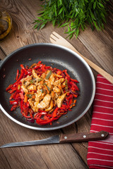 Fried chicken pieces with vegetables.