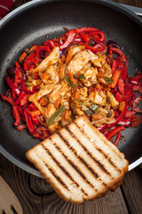 Fried chicken pieces with vegetables.