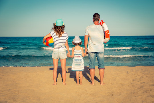 Happy family having fun on the beach
