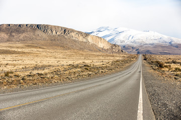 Empty road in El Calafate with a snow mountain, Patagonia Argentina
