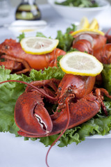 a plate with lettuce and lobster