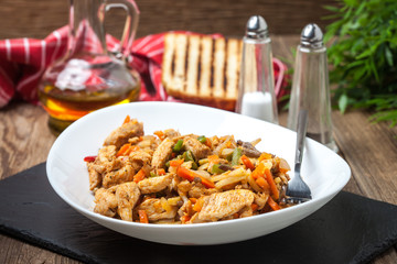 Fried chicken pieces with vegetables.