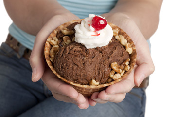 hands with chocolate ice cream