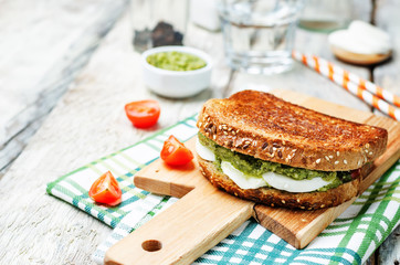 Pesto Mozzarella tomatoes grilled rye sandwich