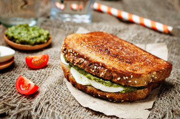 Pesto Mozzarella tomatoes grilled rye sandwich