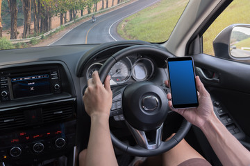 man driving a car and use mobile tablet for check the map
