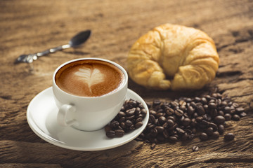 white coffee cup on wooden table