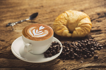 white coffee cup on wooden table