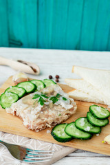 
Ukrainian and Russian national cuisine , the dish is called brawn , boiled pork and turkey in jelly of bouillon with fresh cucumber , salt and spices on a wooden background