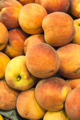 close-up of juicy organic, ripen peaches as background