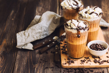 Homemade coffee cocktail with whipped cream and liquid chocolate