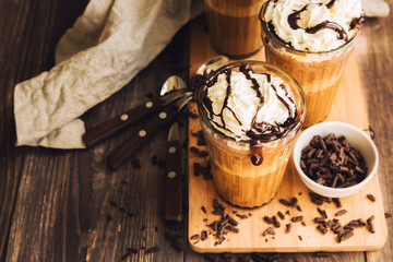 Homemade coffee cocktail with whipped cream and liquid chocolate