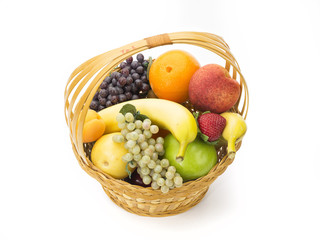 tasty summer fruits in backet isolated on white