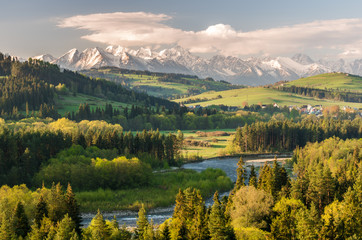 Beautiful spring panorama over Bialka river gorge and Spisz highland to snowy Tatra mountains,...