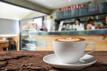 white coffee cup on wooden table