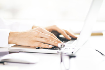 Female hands keyboarding closeup