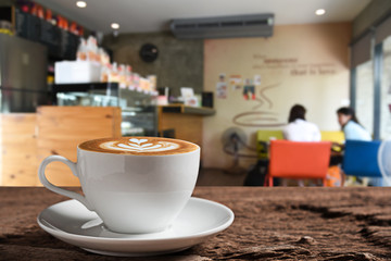 Fototapeta premium white coffee cup on wooden table