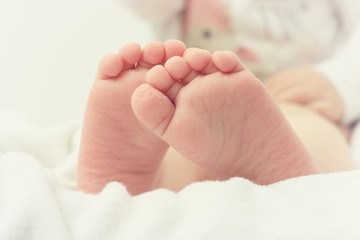 Close up of baby wrinkled feet after bath