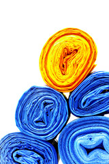 A lot of garbage bags rolls on a white background