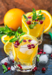 Lemonade - a refreshing drink made of citrus and berries with mint and ice. Selective focus
