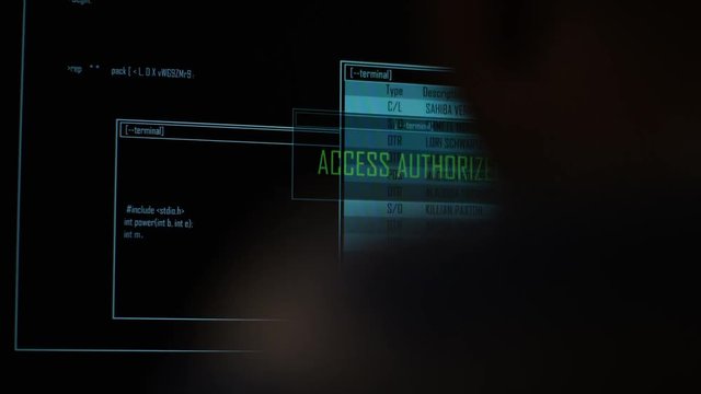 4K Hacker accessing and searching data files at night in the dark