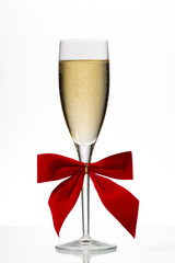 champagne flute with red ribbon