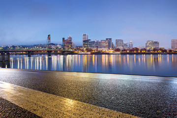 empty asphalt road with cityscape and skyline of portland